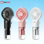 Ventilateur brumisateur portable présenté en trois coloris : noir, rose et blanc, brumisation en fonctionnement
