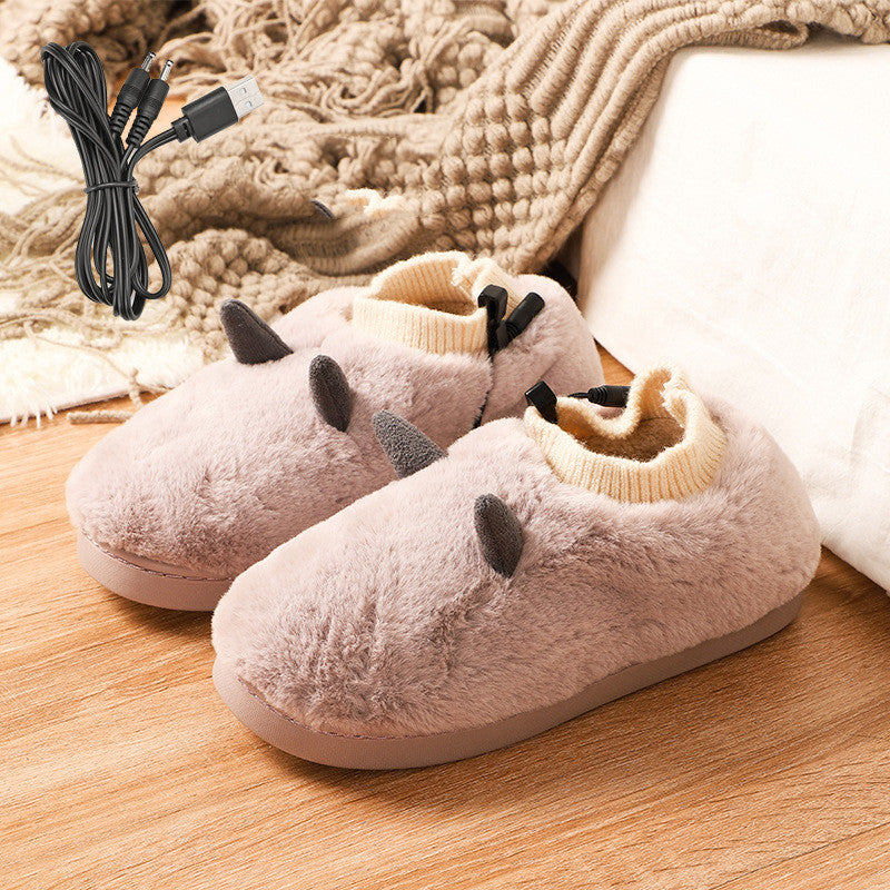 Paire de chaussons chauffants rose poudré molletonnés, vue de trois quarts